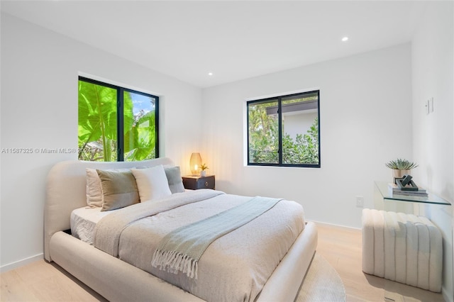 bedroom with light hardwood / wood-style floors