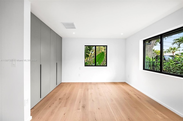 unfurnished bedroom featuring light wood-type flooring