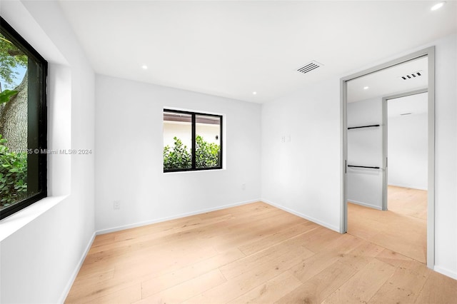 empty room with light hardwood / wood-style floors