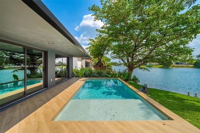 view of pool featuring a water view