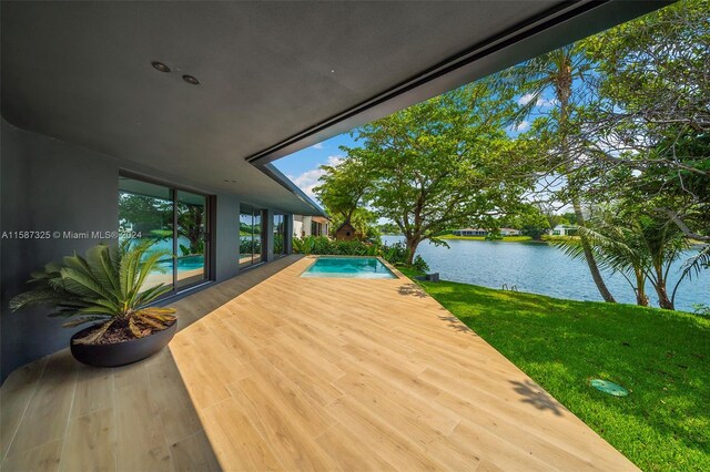 exterior space featuring a water view and a lawn