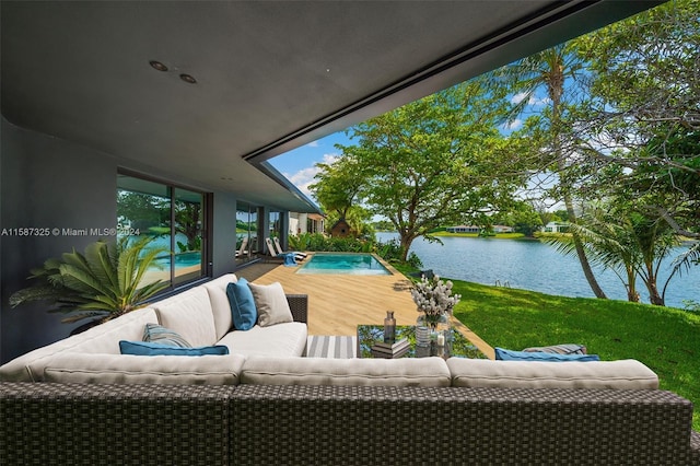 view of patio / terrace with a water view and an outdoor living space