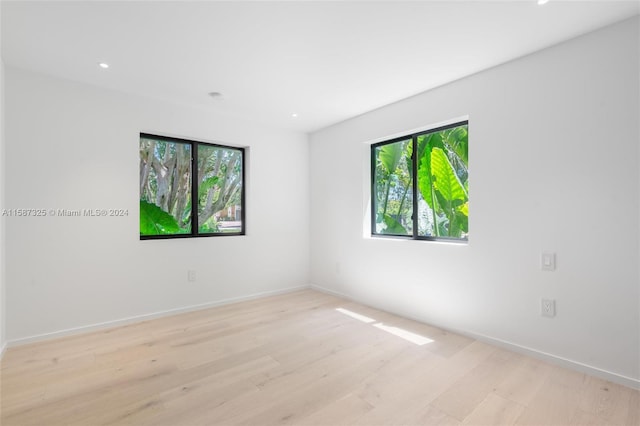 spare room with light hardwood / wood-style floors