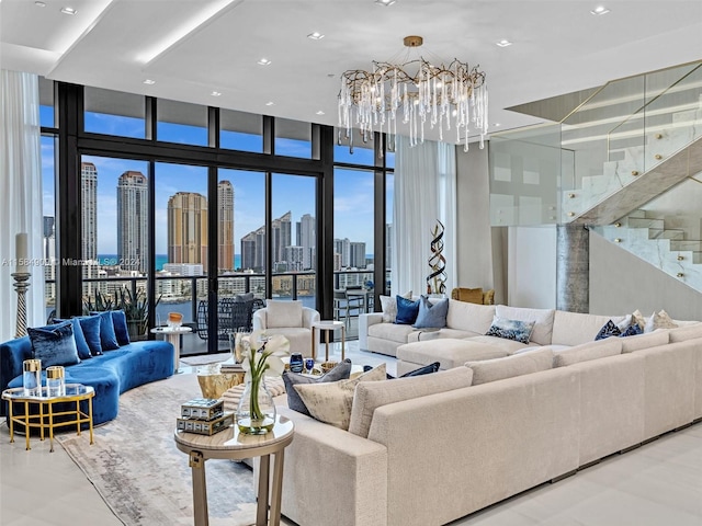 tiled living room featuring an inviting chandelier and expansive windows