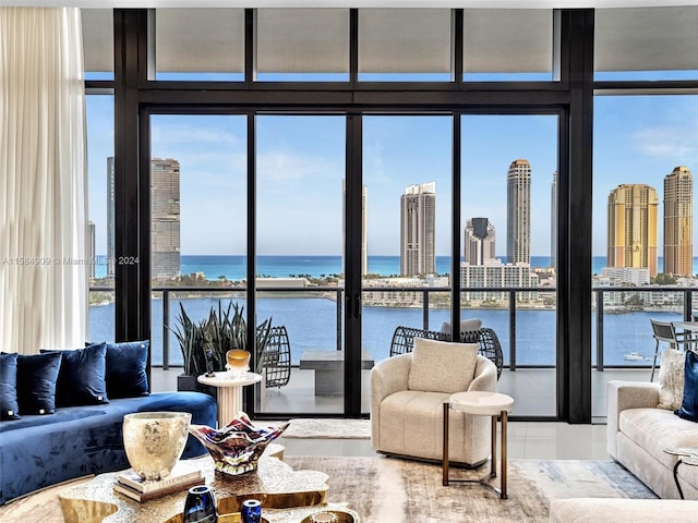 living room with a wall of windows and a water view