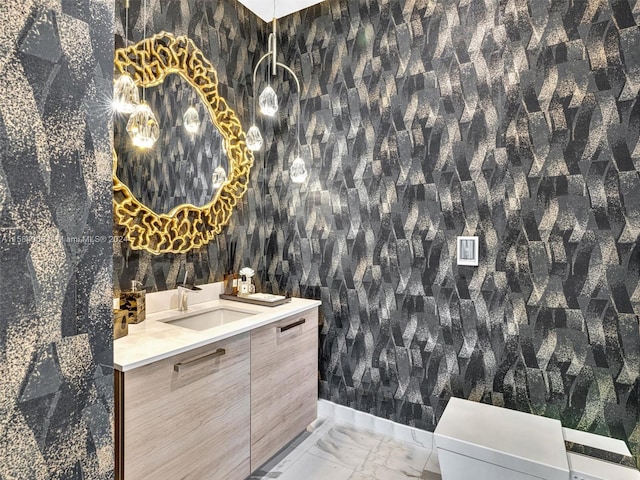 bathroom featuring tile flooring, toilet, and vanity with extensive cabinet space