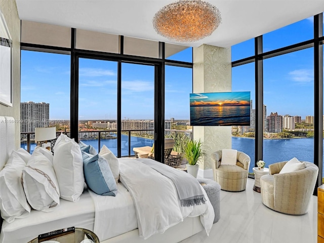 bedroom featuring expansive windows and a water view