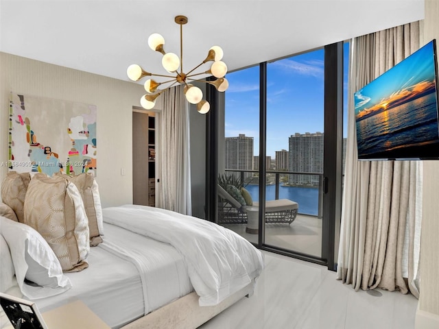 bedroom with access to exterior, expansive windows, a water view, and a chandelier