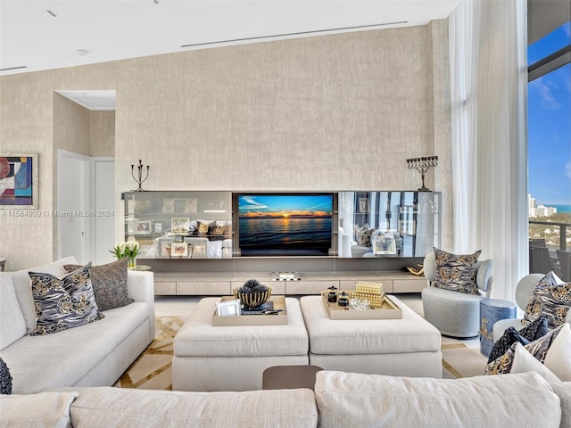 living room with high vaulted ceiling