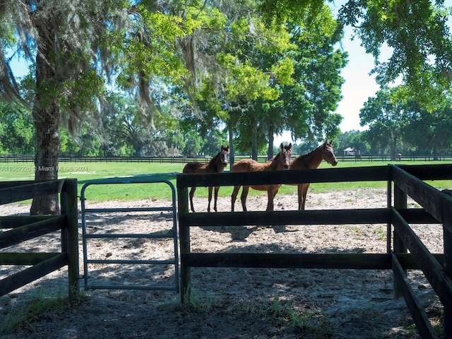 7787 NW 150th Ave, Ocala, FL 32668 - gate featuring a view of rural / pastoral area and an exterior structure