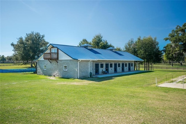 7787 NW 150th Ave, Ocala, FL 32668 - back of house with a patio, metal roof, and concrete block siding