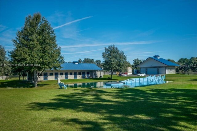7787 NW 150th Ave, Ocala, FL 32668 - view of pool with a yard