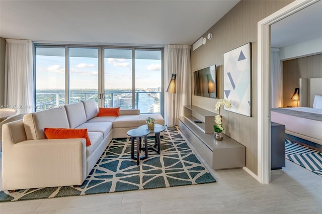 living room featuring a wall of windows