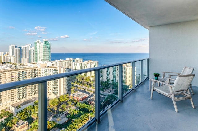 balcony featuring a water view