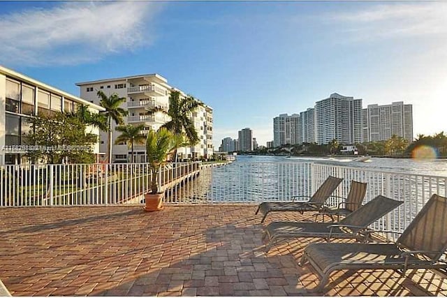 view of pool with a water view