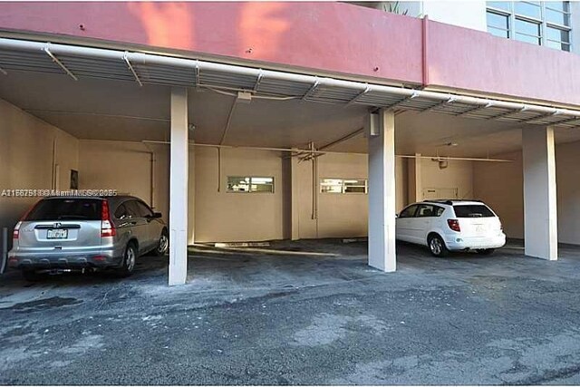 view of parking / parking lot featuring a carport