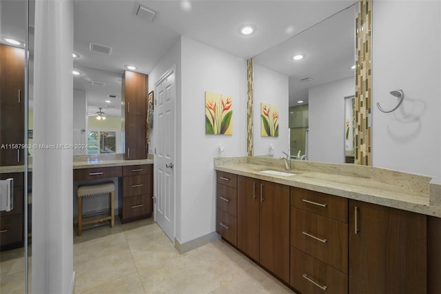 bathroom featuring tile flooring, ceiling fan, and vanity