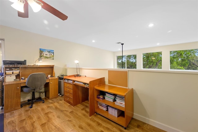 office space featuring ceiling fan and light hardwood / wood-style flooring