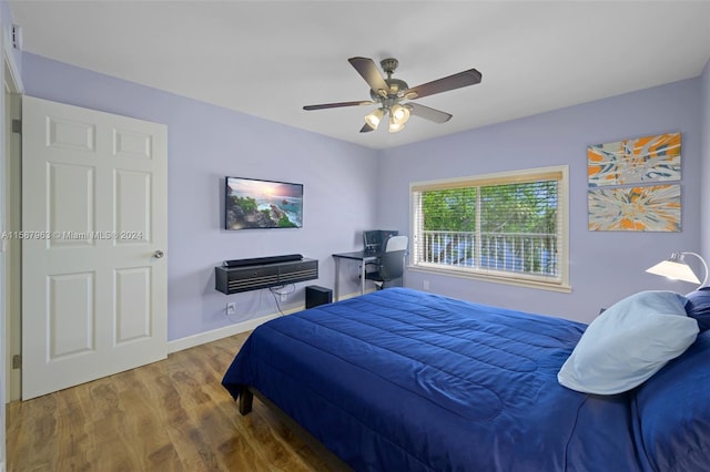 bedroom featuring ceiling fan and hardwood / wood-style floors