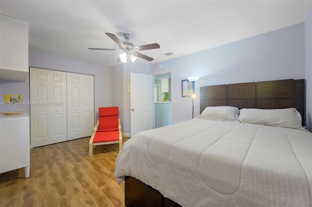 bedroom with wood-type flooring, a closet, and ceiling fan