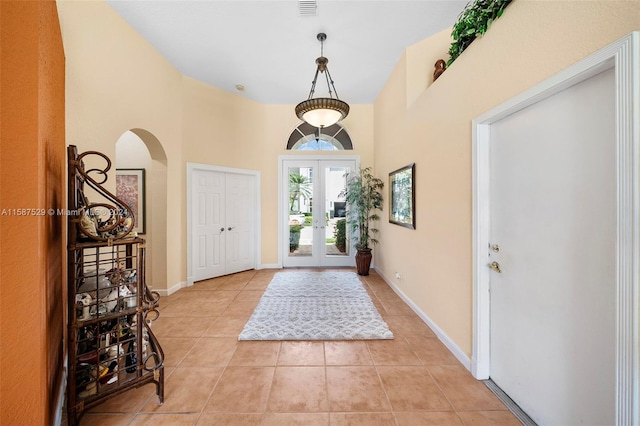 tiled entrance foyer with french doors