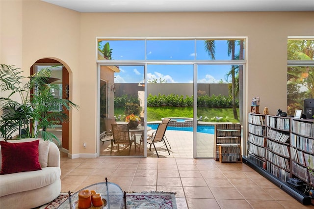 interior space with light tile patterned floors and a wealth of natural light