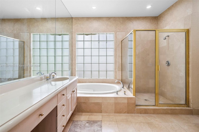 bathroom with vanity, shower with separate bathtub, and tile patterned flooring