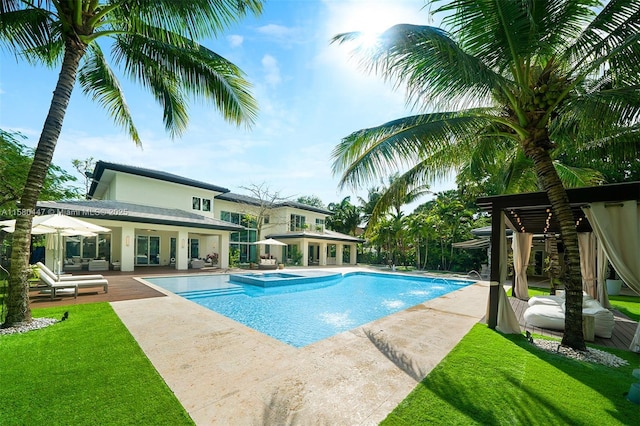 view of swimming pool with a yard, an in ground hot tub, and a patio