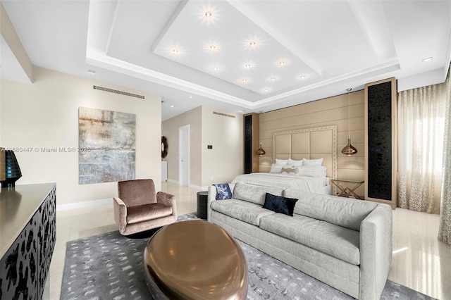 tiled bedroom featuring a raised ceiling