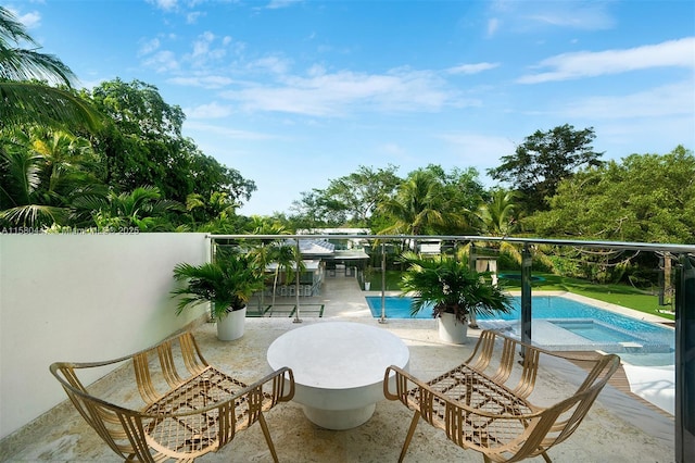 balcony featuring a patio area