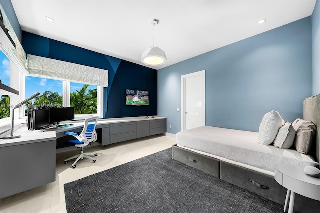 bedroom featuring built in desk