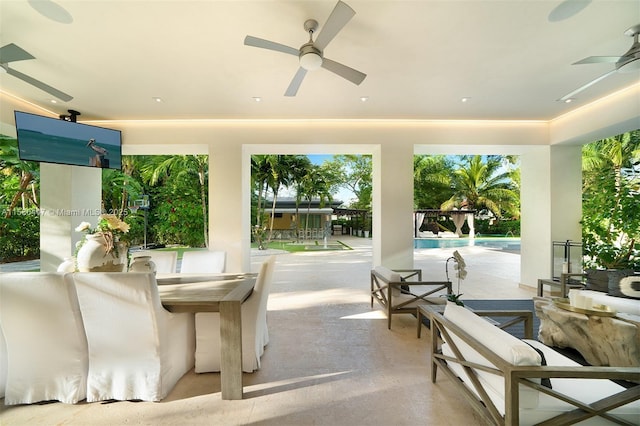 view of patio featuring an outdoor living space and ceiling fan