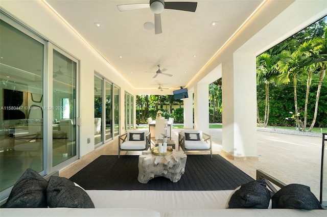 view of patio featuring outdoor lounge area and ceiling fan