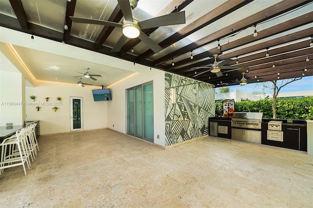 view of patio / terrace featuring grilling area, exterior kitchen, and ceiling fan