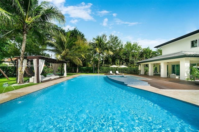 outdoor pool with a gazebo and a patio area