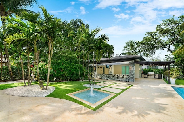 surrounding community with a patio and a swimming pool