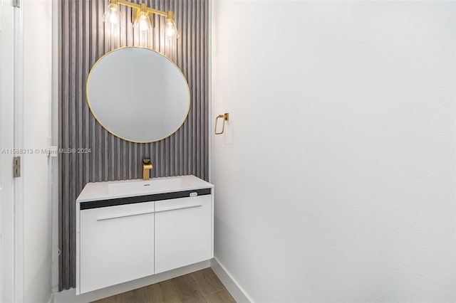 bathroom with vanity and hardwood / wood-style flooring