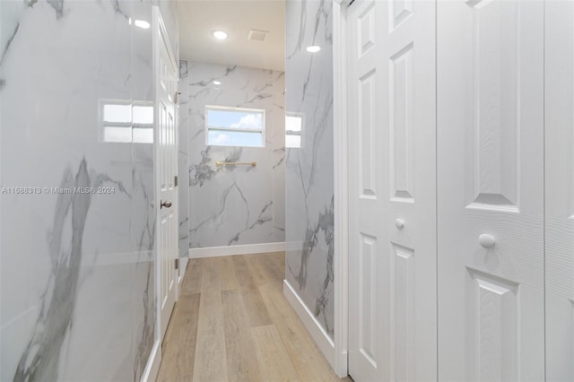 bathroom with hardwood / wood-style flooring