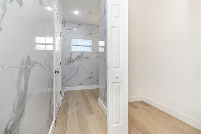 bathroom with hardwood / wood-style floors