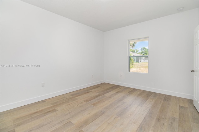 unfurnished room featuring light hardwood / wood-style flooring