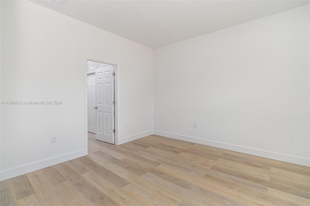 unfurnished room with light hardwood / wood-style floors