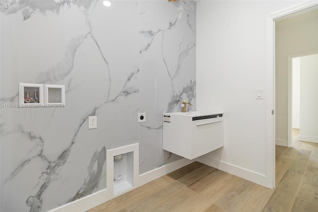 bathroom with wood-type flooring