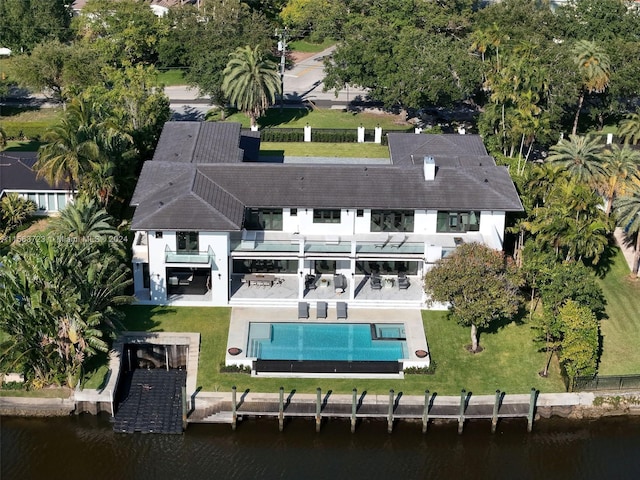 birds eye view of property featuring a water view