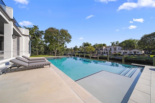 view of swimming pool featuring a patio area