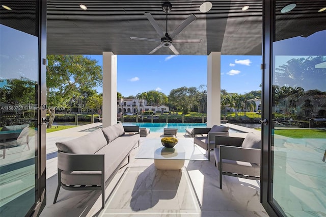 view of patio featuring an outdoor living space and ceiling fan