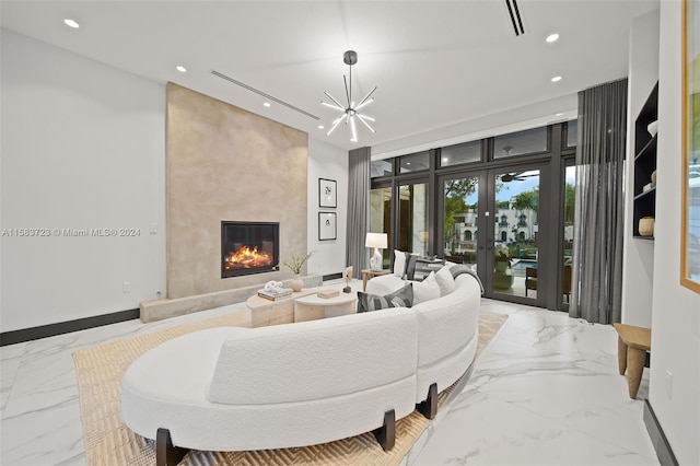 tiled living room featuring a premium fireplace, french doors, and a chandelier