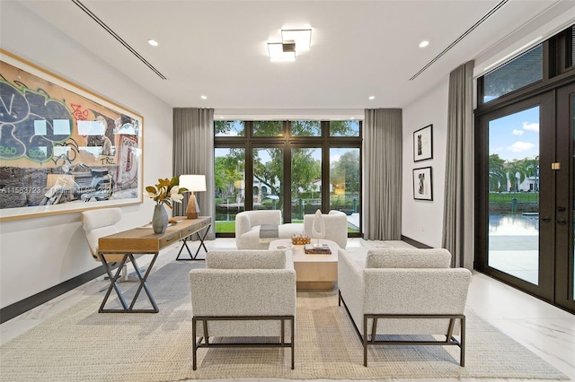 living room featuring french doors, floor to ceiling windows, and light tile floors