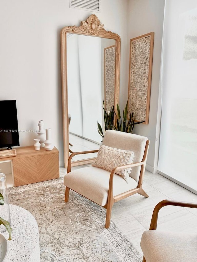 living area with tile flooring