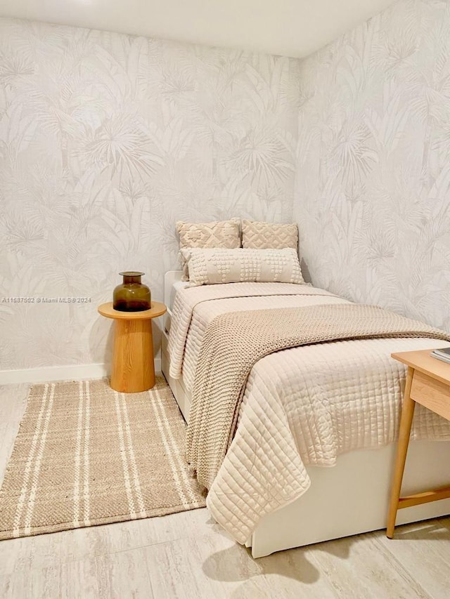 bedroom featuring wood-type flooring