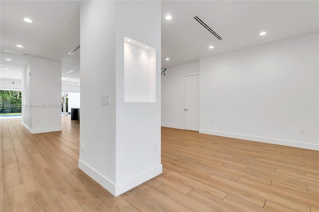 spare room with light hardwood / wood-style floors